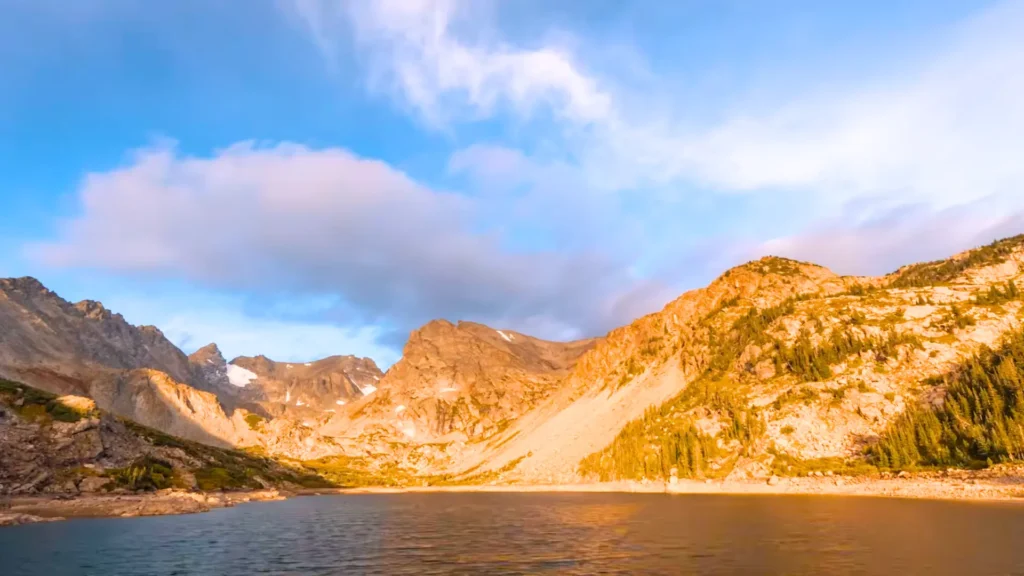 Isabelle Glacier near Denver, Colorado, surrounded by Rocky Mountain peaks and an alpine lake Isabelle Glacier in Denver, Colorado